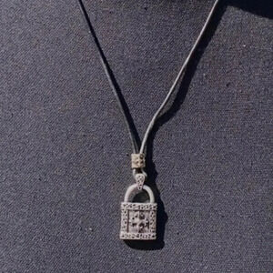 Stigma black cord/silver lock‎ pendant necklace